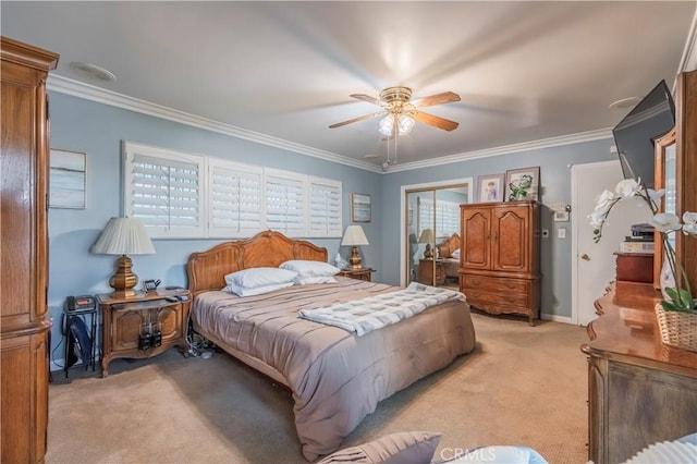 bedroom featuring ceiling fan, light colored carpet, crown molding, and a closet