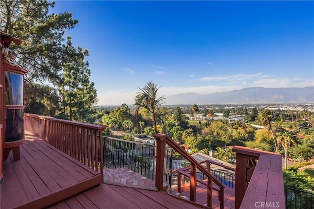 wooden terrace featuring a mountain view