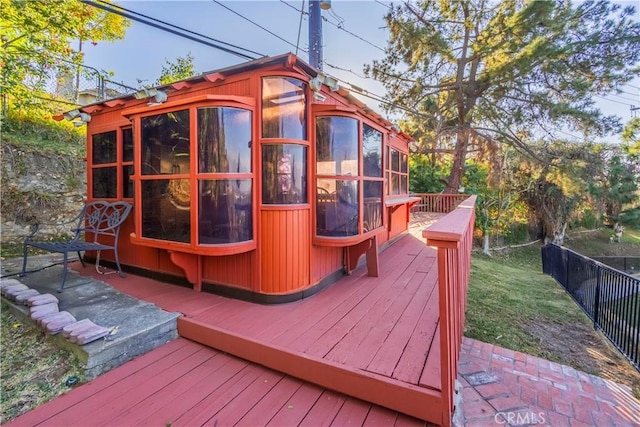 wooden terrace with a sunroom