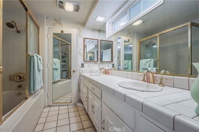 bathroom with shower / bath combination with glass door, vanity, and tile patterned floors