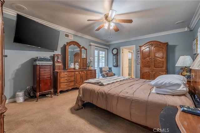 carpeted bedroom featuring ceiling fan and ornamental molding