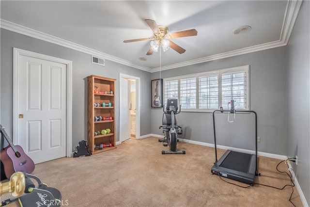 workout room featuring light carpet, crown molding, and ceiling fan