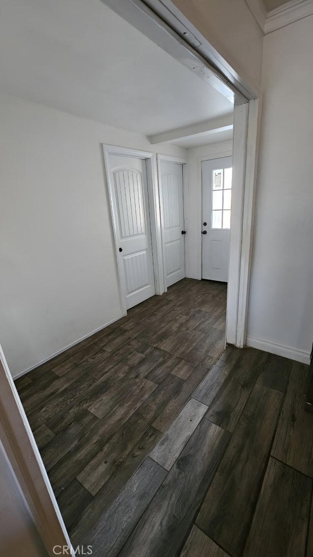 spare room with dark hardwood / wood-style floors