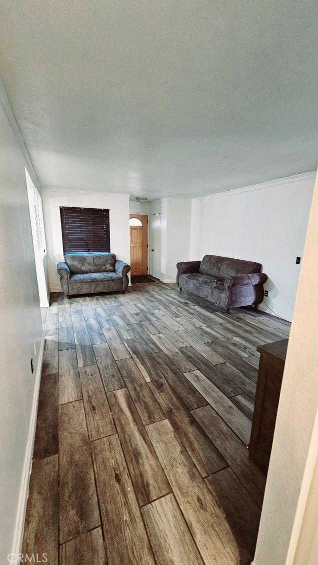 unfurnished living room featuring hardwood / wood-style flooring