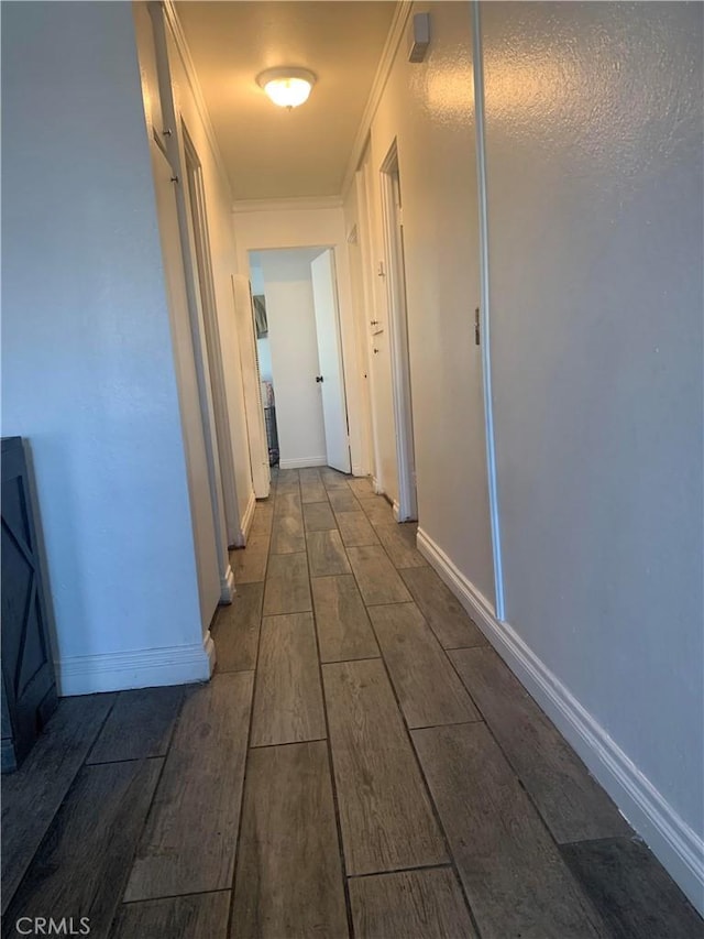 corridor featuring crown molding