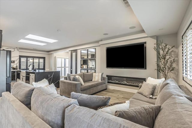 living room with light hardwood / wood-style flooring