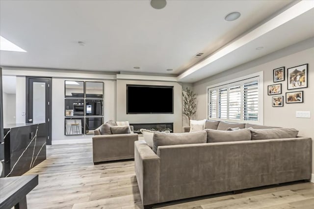 living room with light hardwood / wood-style floors