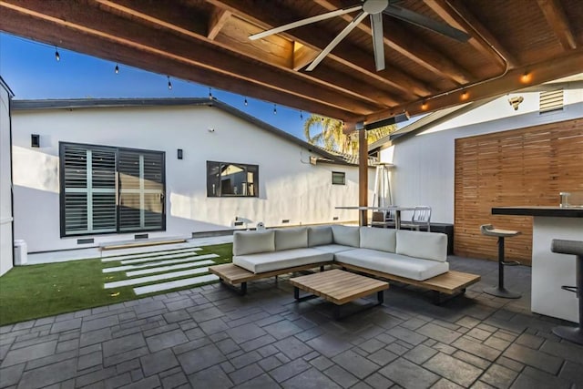 view of patio with ceiling fan and outdoor lounge area