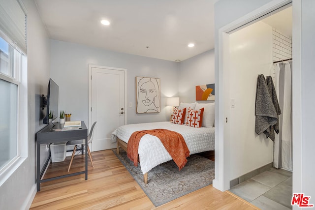 bedroom with light wood-type flooring