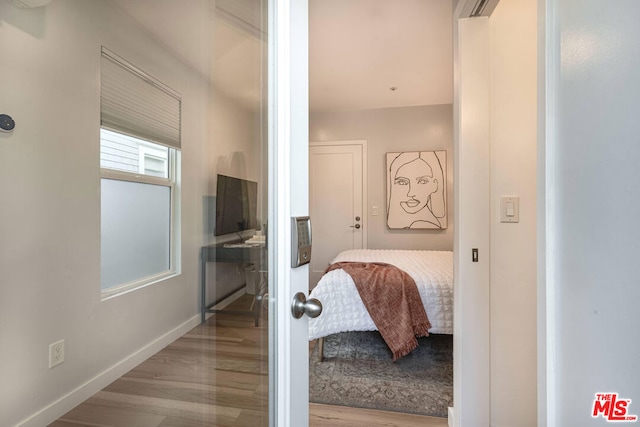 bedroom featuring light wood-type flooring