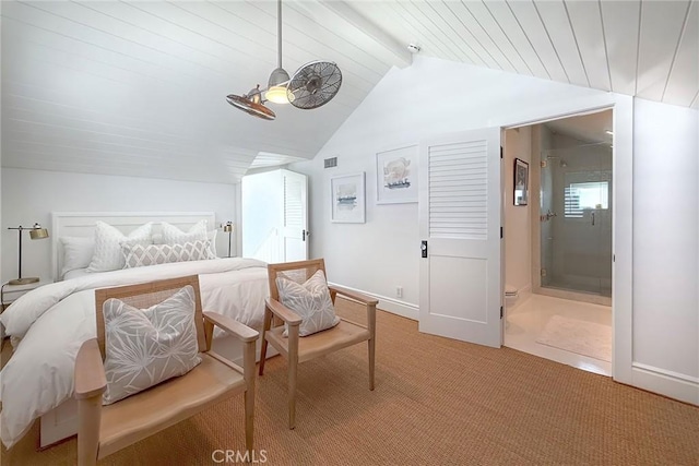 carpeted bedroom with lofted ceiling with beams and ensuite bathroom