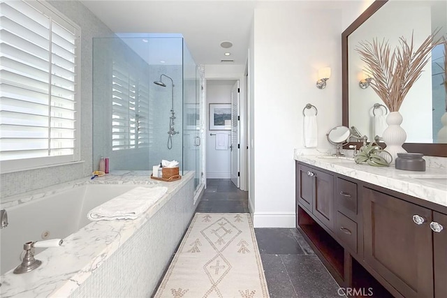 bathroom featuring tile patterned flooring, vanity, and shower with separate bathtub