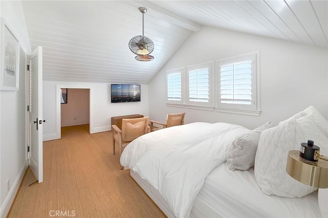 bedroom with light hardwood / wood-style flooring and lofted ceiling with beams