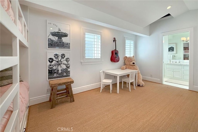 playroom with light colored carpet and vaulted ceiling