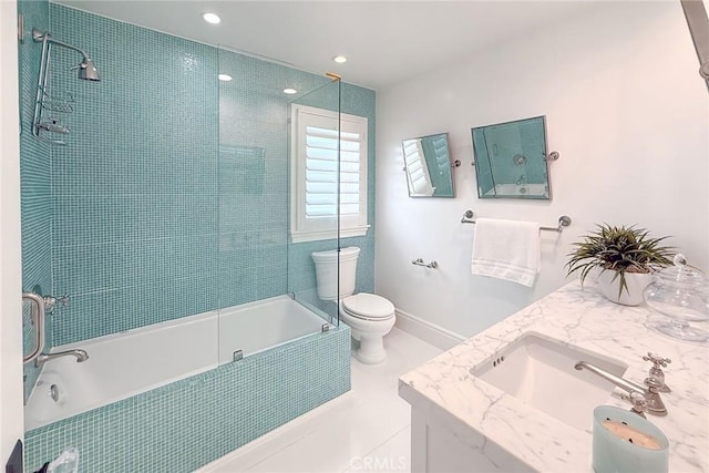 full bathroom with vanity, tiled shower / bath combo, tile patterned floors, and toilet