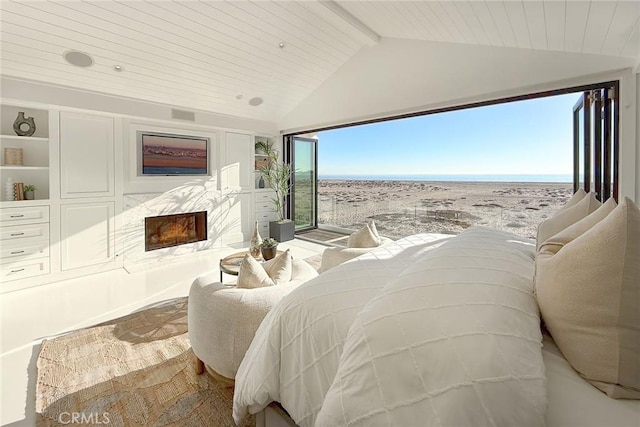 bedroom with vaulted ceiling with beams and wood ceiling