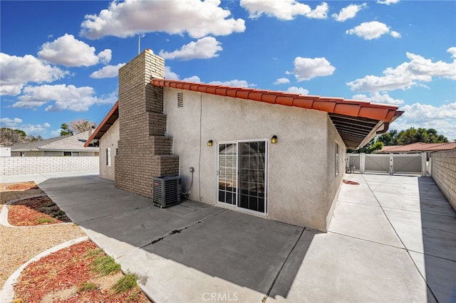 exterior space featuring a patio area and cooling unit