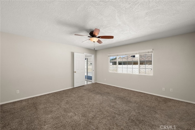 empty room featuring a textured ceiling and carpet floors