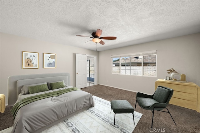 carpeted bedroom with a textured ceiling and ceiling fan