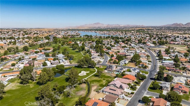 drone / aerial view with a water and mountain view