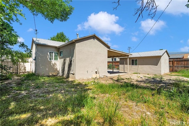 rear view of property featuring a patio