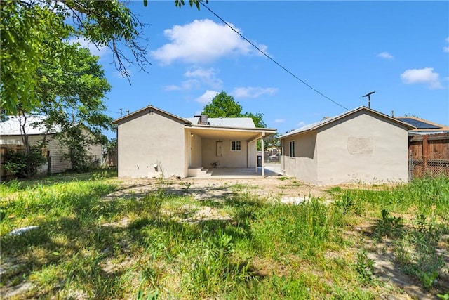 back of house featuring a patio area