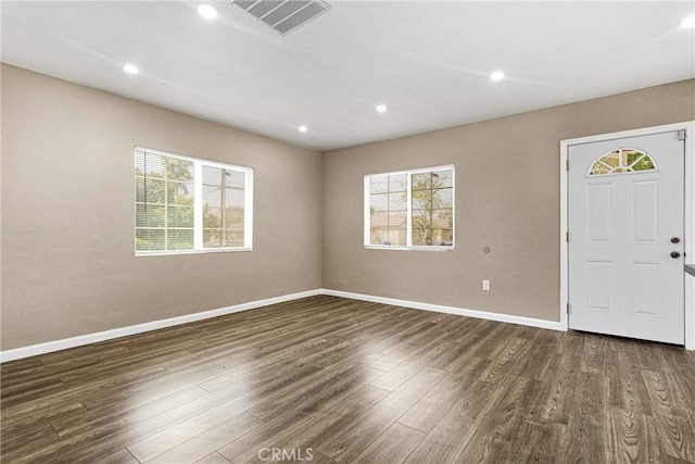 foyer entrance with dark hardwood / wood-style floors