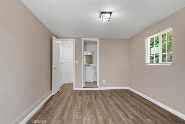 unfurnished room featuring hardwood / wood-style floors