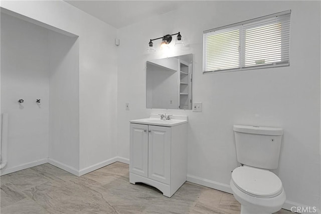 bathroom with toilet and vanity