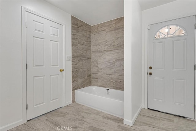 bathroom with shower / washtub combination