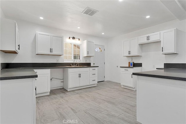 kitchen with sink and white cabinets