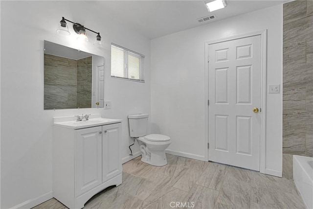 bathroom with toilet and vanity