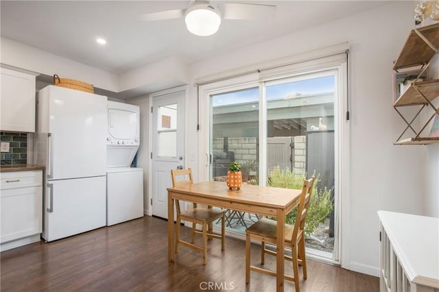 4698 Heil Ave Unit 23C, Huntington Beach, CA 92649 - dining room with stacked washer / dryer, dark wood-style flooring, ceiling fan, and recessed lighting