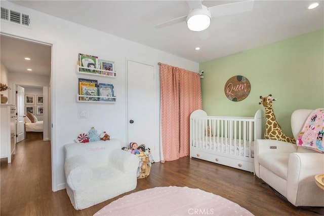 4698 Heil Ave Unit 23C, Huntington Beach, CA 92649 - bedroom featuring wood finished floors, recessed lighting, ceiling fan, and a crib