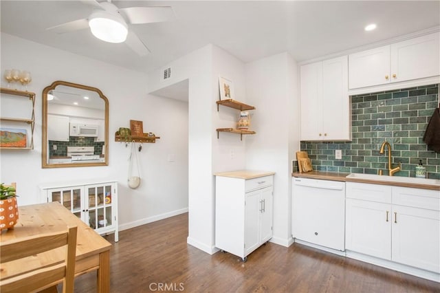 4698 Heil Ave Unit 23C, Huntington Beach, CA 92649 - kitchen with white appliances, decorative backsplash, white cabinets, dark wood-type flooring, and recessed lighting