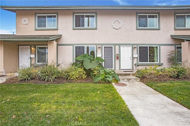 4698 Heil Ave Unit 23C, Huntington Beach, CA 92649 - multi unit property featuring stucco siding and a front yard