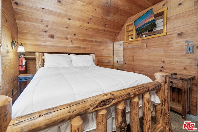 carpeted bedroom featuring wood walls, wooden ceiling, and vaulted ceiling