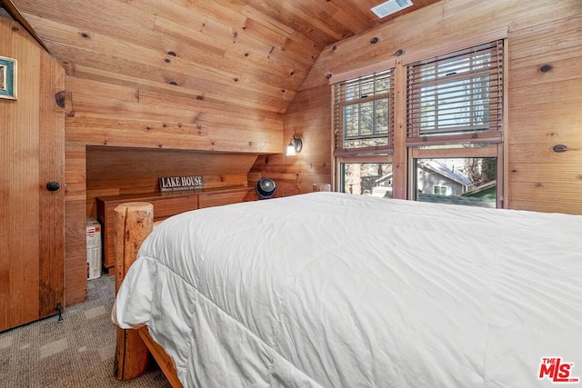 bedroom with carpet flooring, wooden walls, wood ceiling, and lofted ceiling