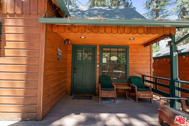 doorway to property with a wooden deck