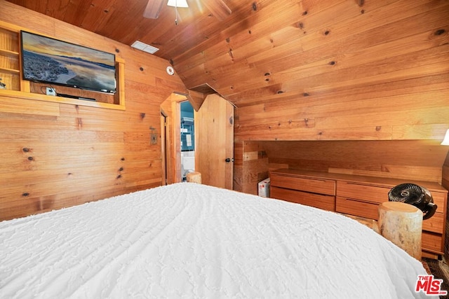 bedroom with wooden walls, ceiling fan, lofted ceiling, and wood ceiling