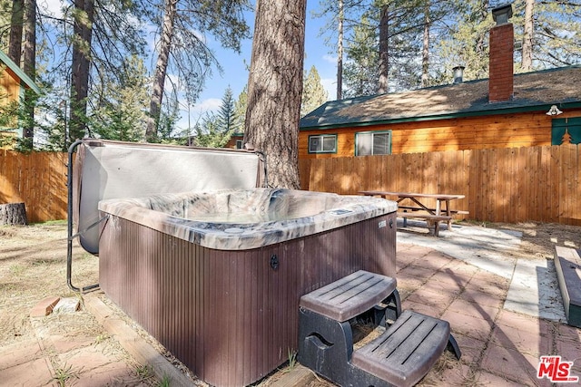 view of patio featuring a hot tub