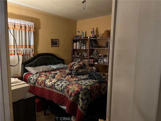 bedroom featuring crown molding