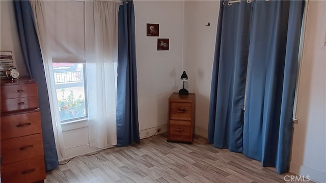 bedroom with light hardwood / wood-style flooring