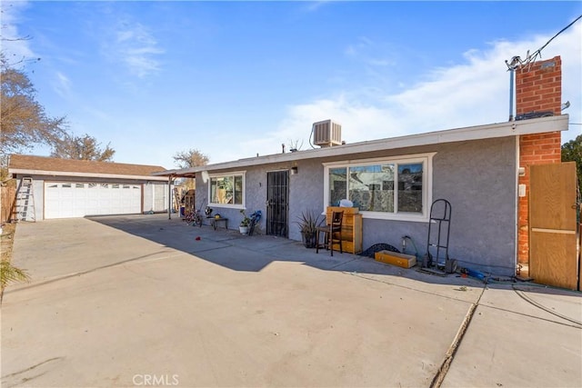 ranch-style house featuring cooling unit