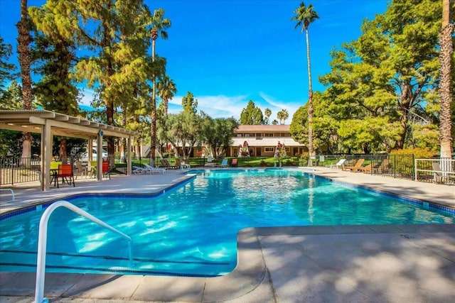 view of pool with a pergola and a patio