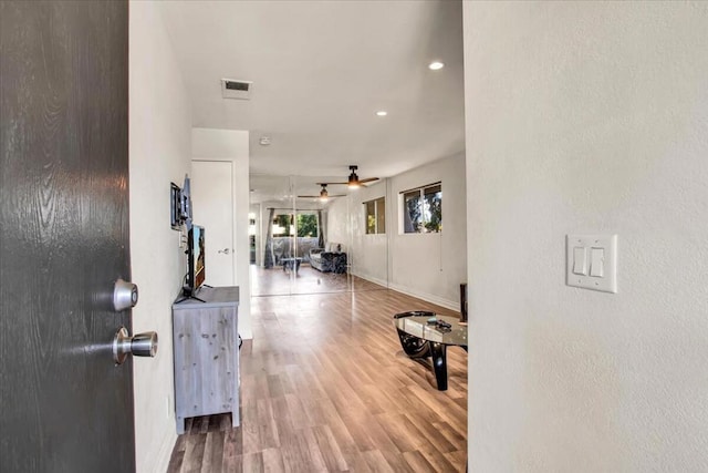 entryway with hardwood / wood-style floors and ceiling fan