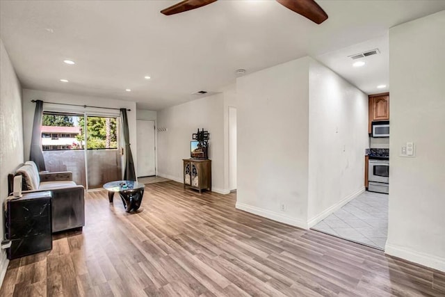 living room with light hardwood / wood-style floors