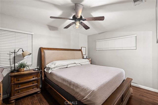 bedroom featuring ceiling fan and dark wood-type flooring