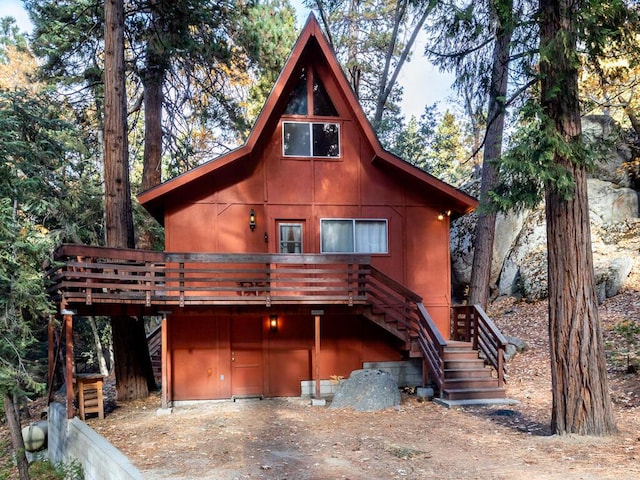 log cabin featuring a deck