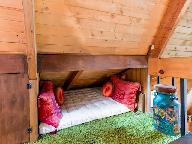 bedroom featuring wood ceiling, beamed ceiling, and wood walls